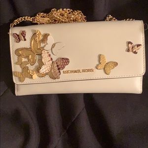 A Michael kors cross body/clutch wallet